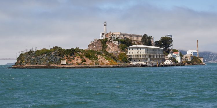 Alcatraz Island as seen from the East. The small island in the San Francisco Bay was developed with facilities for a lighthouse, a military fortification, and a prison. It received designation as a National Historic Landmark in 1986.
