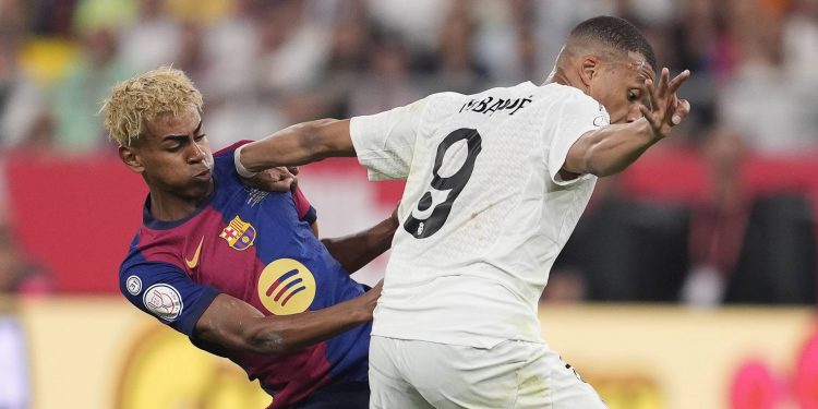 Kylian Mbappe of Real Madrid and Lamine Yamal of FC Barcelona in action during the Spanish Cup, Copa del Rey, Final football match played between FC Barcelona and Real Madrid at La Cartuja Stadium on April 26, 2025 in Sevilla, Spain.