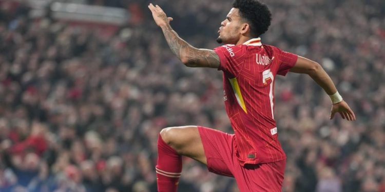 Liverpool's Luis Diaz celebrates after scoring his side's opening goal during the Champions League opening phase soccer match between Liverpool and Bayer Leverkusen at Anfield in Liverpool, England, Tuesday, Nov. 5, 2024. (AP Photo/Jon Super) (Liverpo